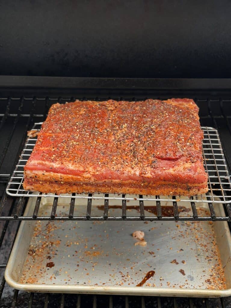 Pork Belly on wire rack in Smoker.