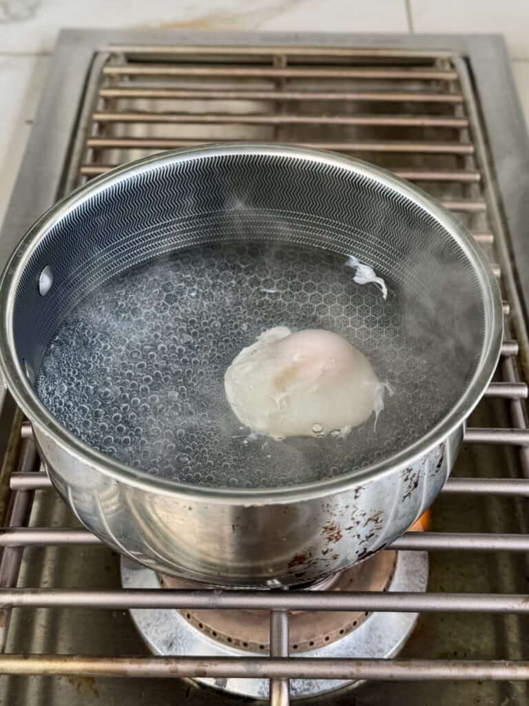 Poached egg in boiling water.