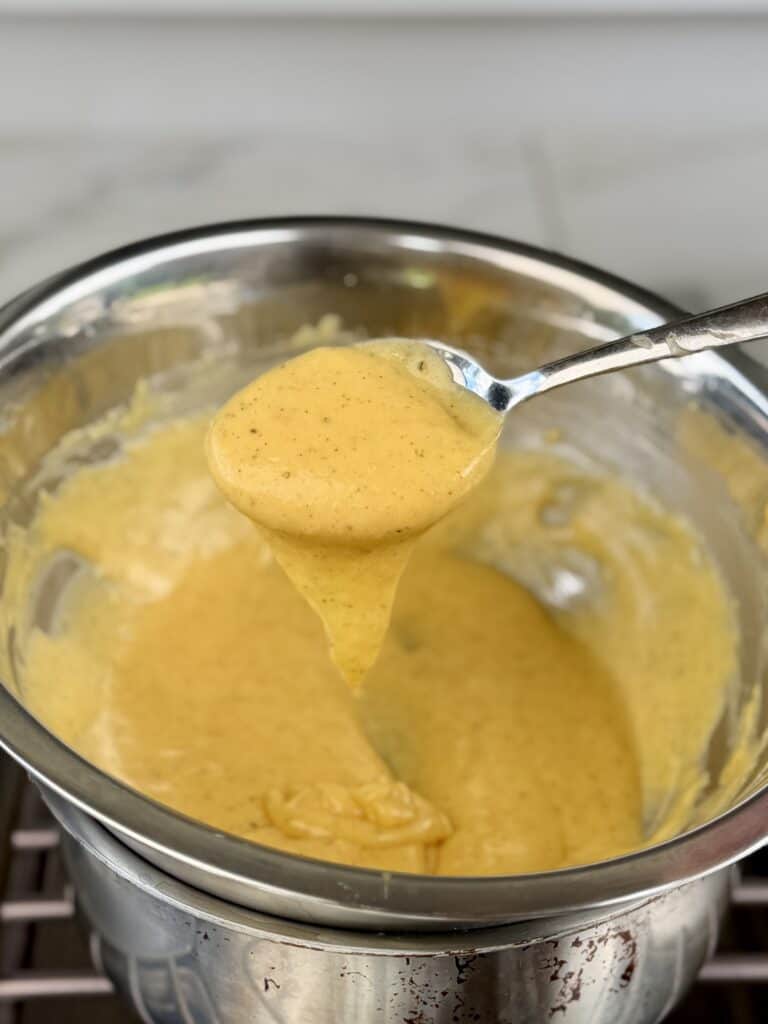 Finished sauce stirred with spoon.