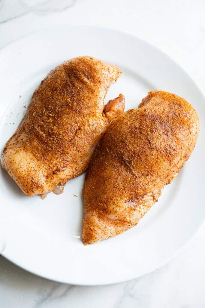 Seasoned Chicken Breast on Plate.