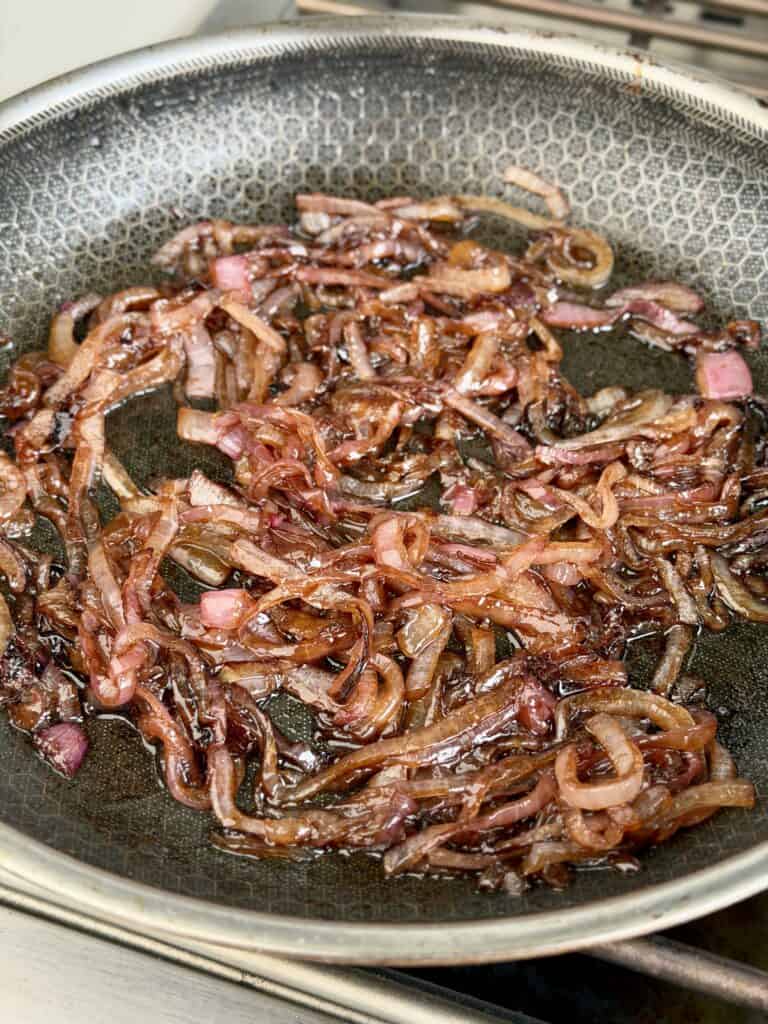 Onions cooking in a pad.