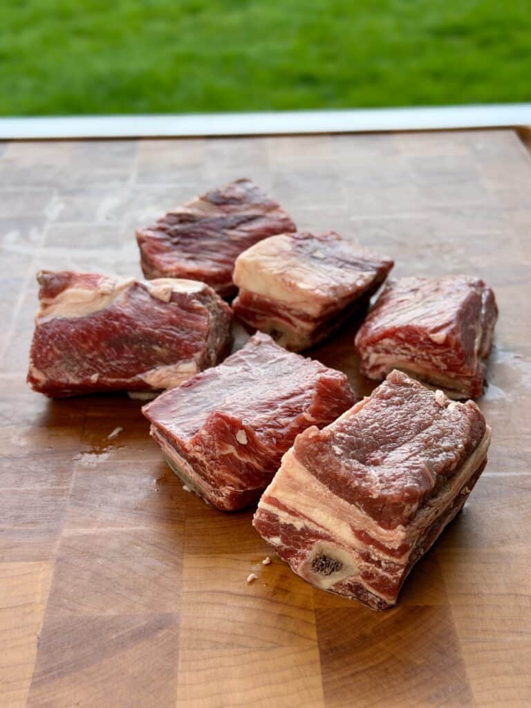 Smoked Beef Short Rib meat on cutting board.