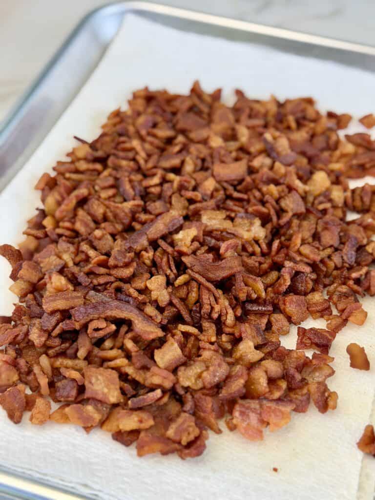 Cooked bacon on paper towel.
