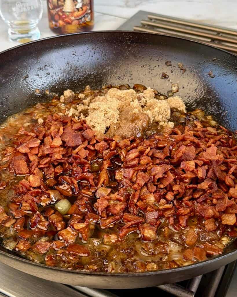 Cooked bacon and ingredients in pan.