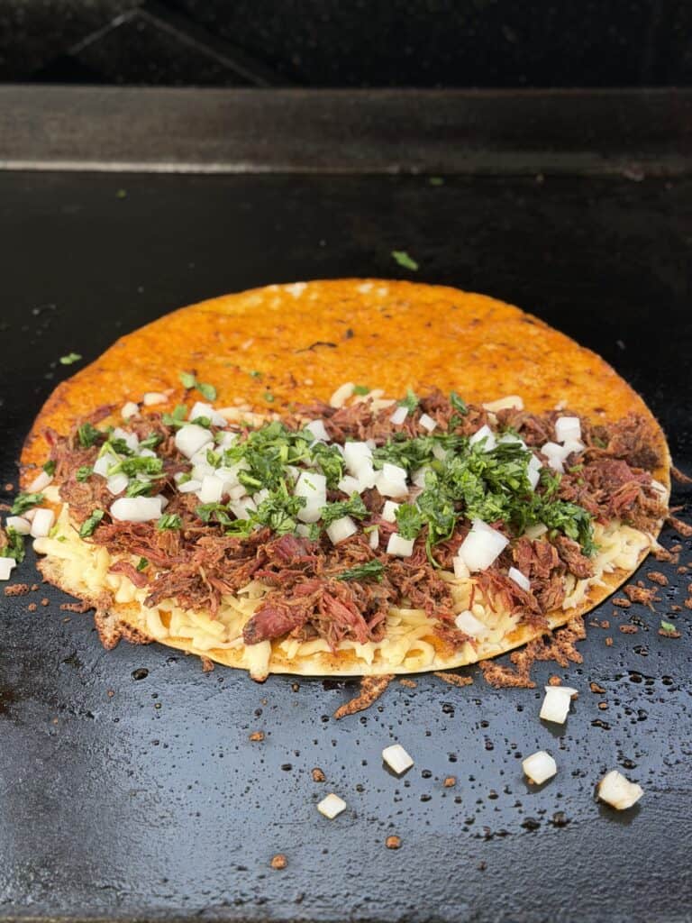 Birria Quesadilla on griddle.