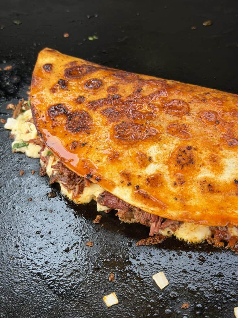 Birria Quesadilla on griddle.