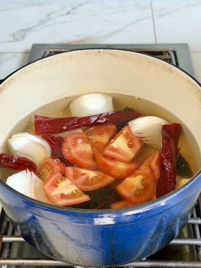 Ingredients in water in pan.