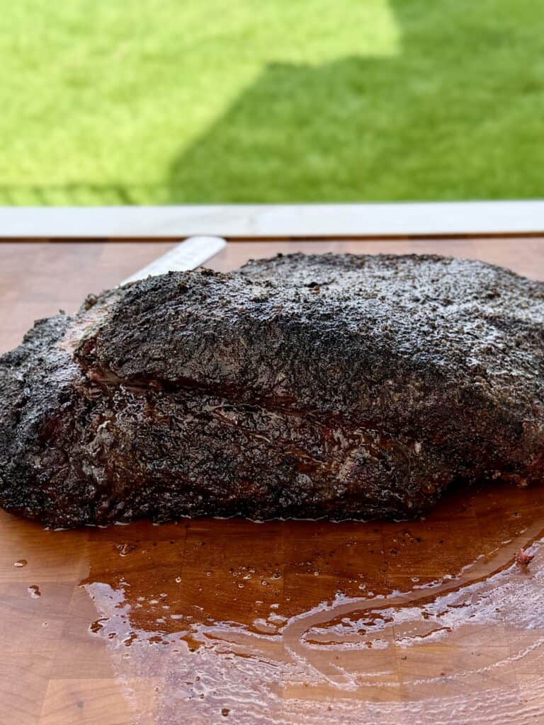 cooked Brisket Burnt Ends on cutting board.
