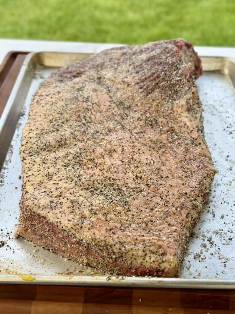 Seasoned meat on pan.