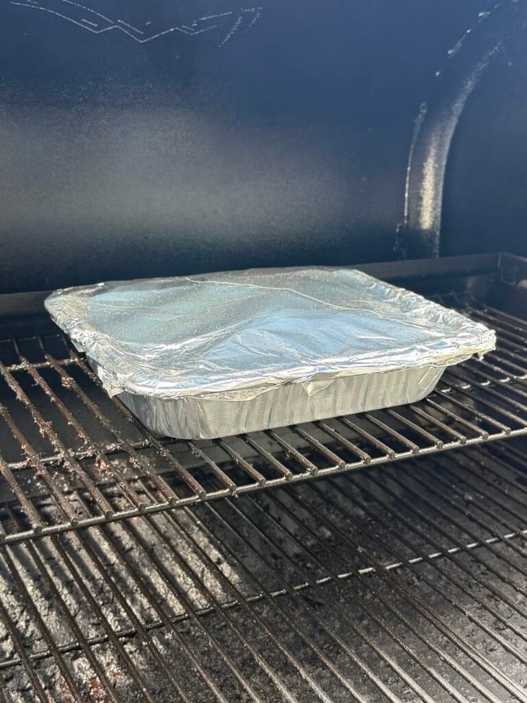 Aluminum pan on smoker.
