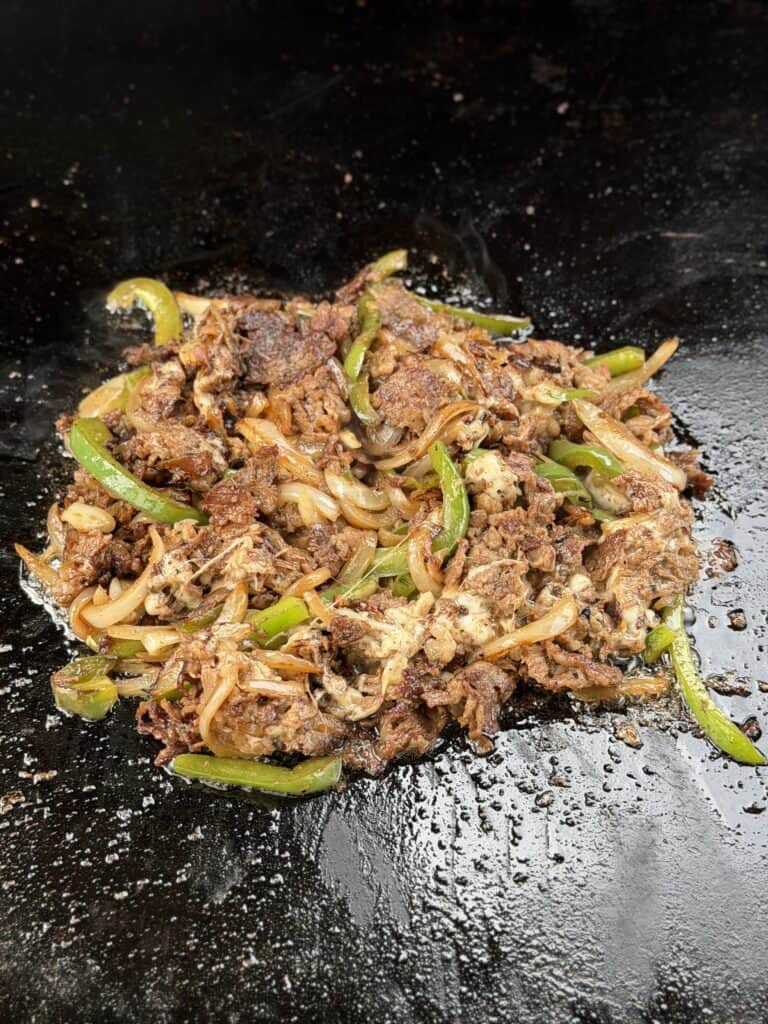Cheesesteak Croissant Sandwich
mixture on griddle.