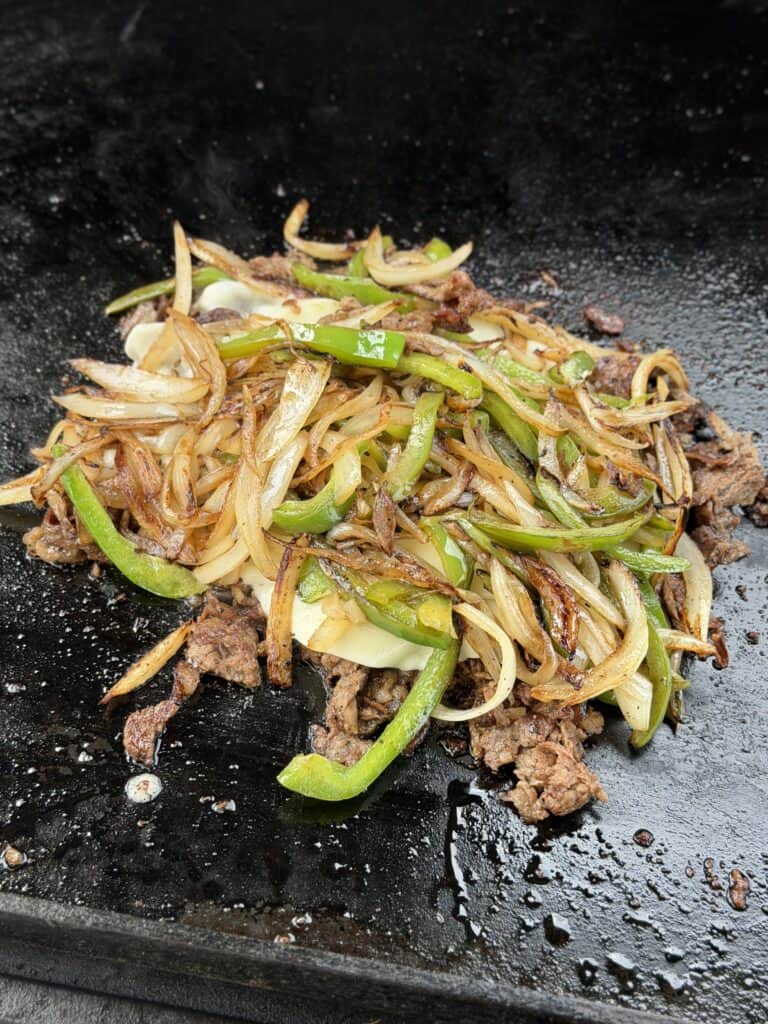Cheesesteak Mixed together on griddle.