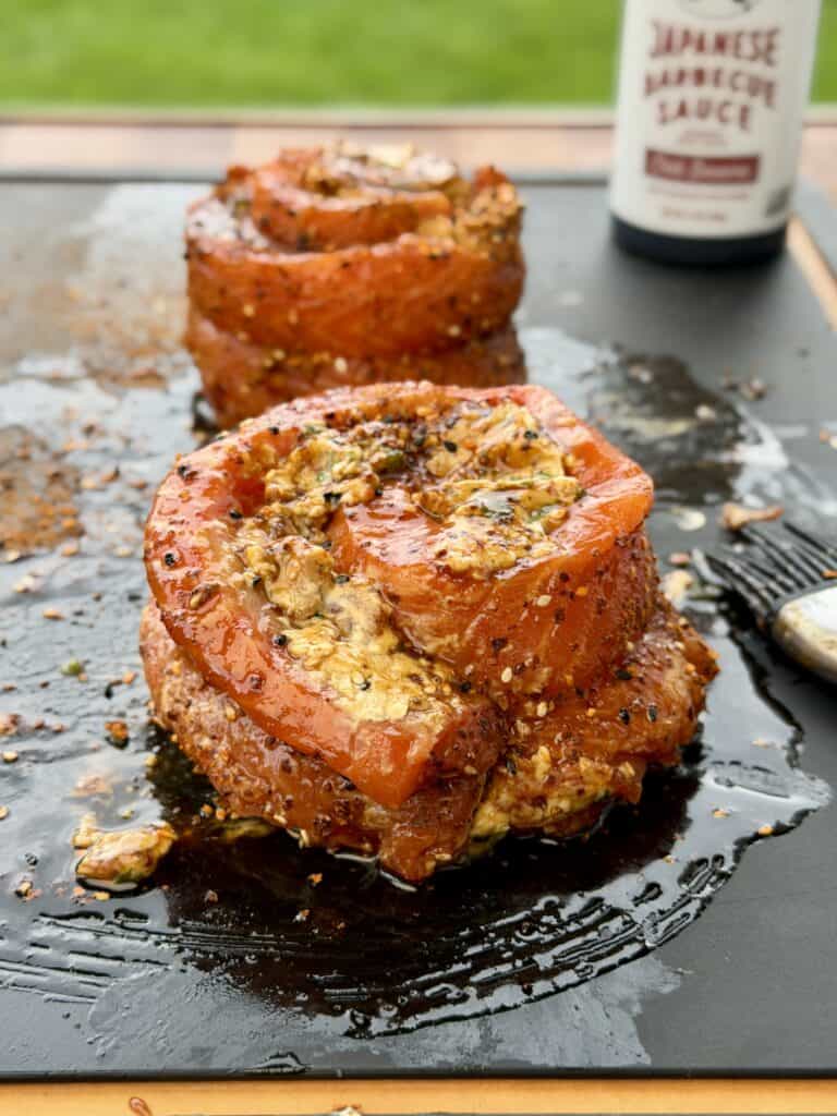 Seasoned Salmon Pinwheels on cutting board.