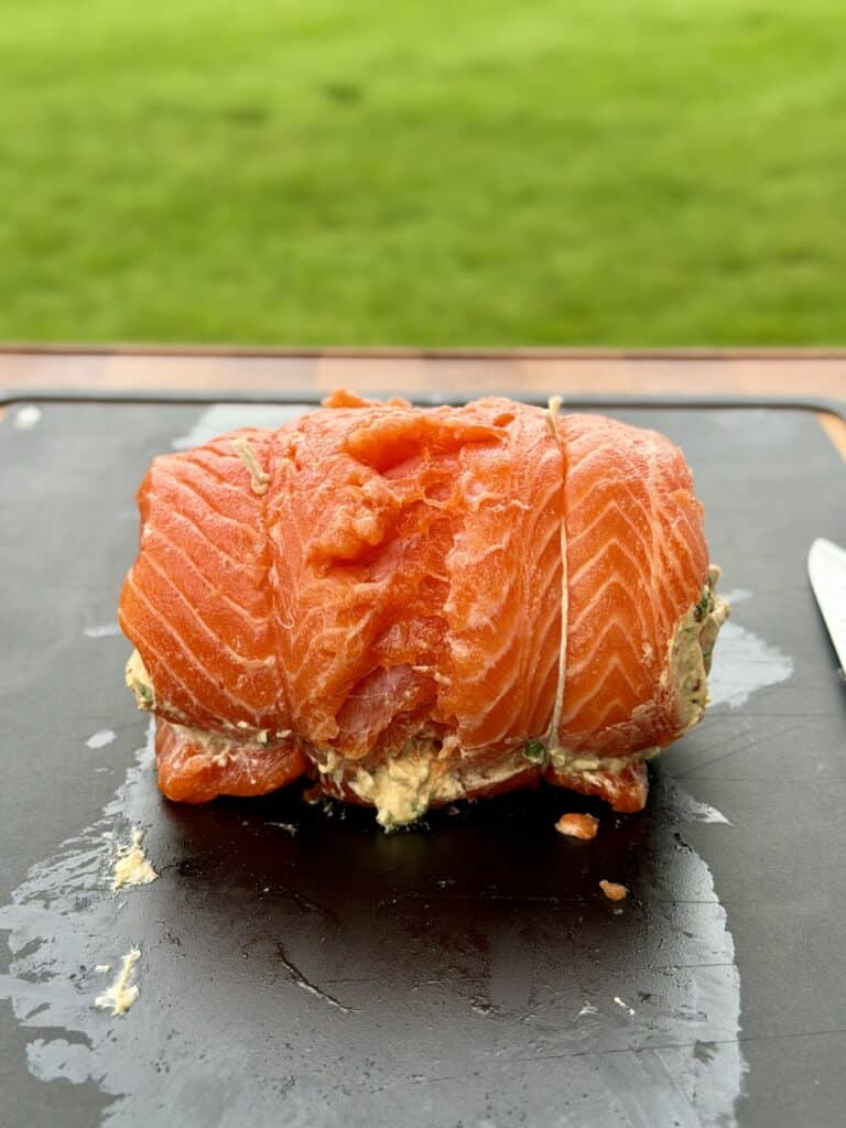 Salmon on cutting board.