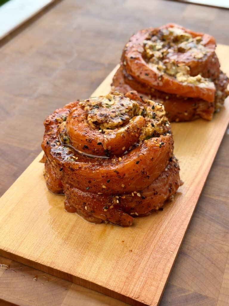 Salmon Pinwheels on plank board.
