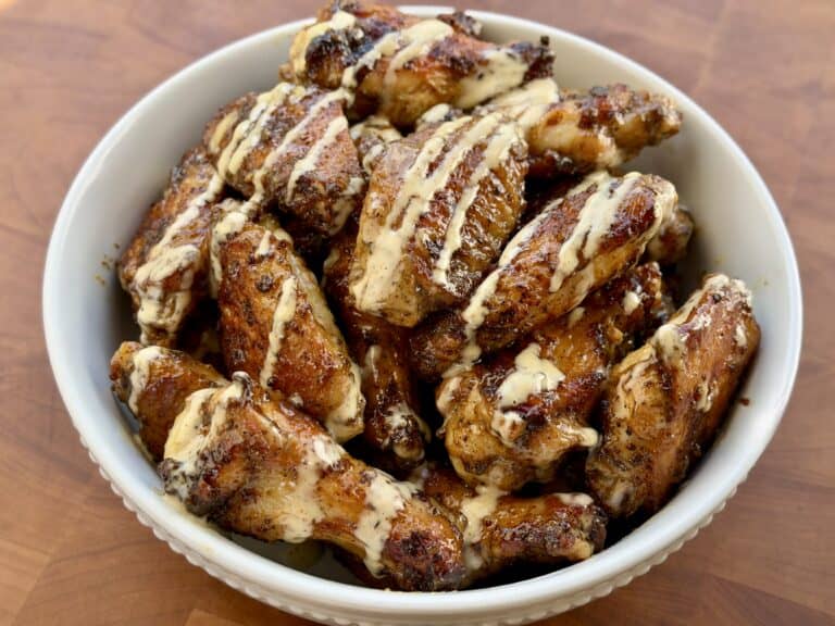 Grilled Cajun wings with Alabama White Sauce.