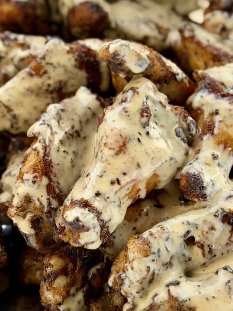 Grilled Cajun wings with Alabama White Sauce.