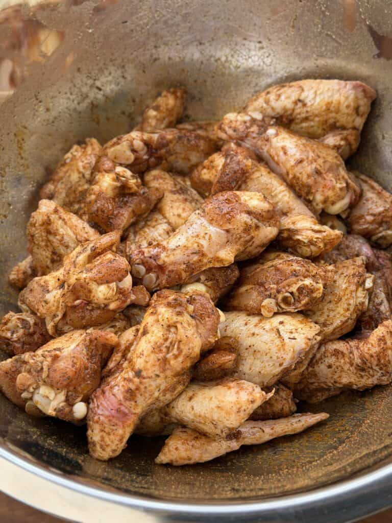 Uncooked Chicken wings in bowl.