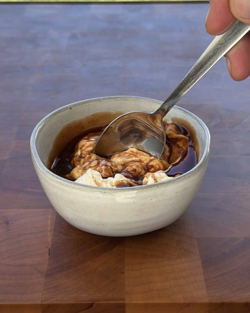 Mixture in small bowl with spoon.