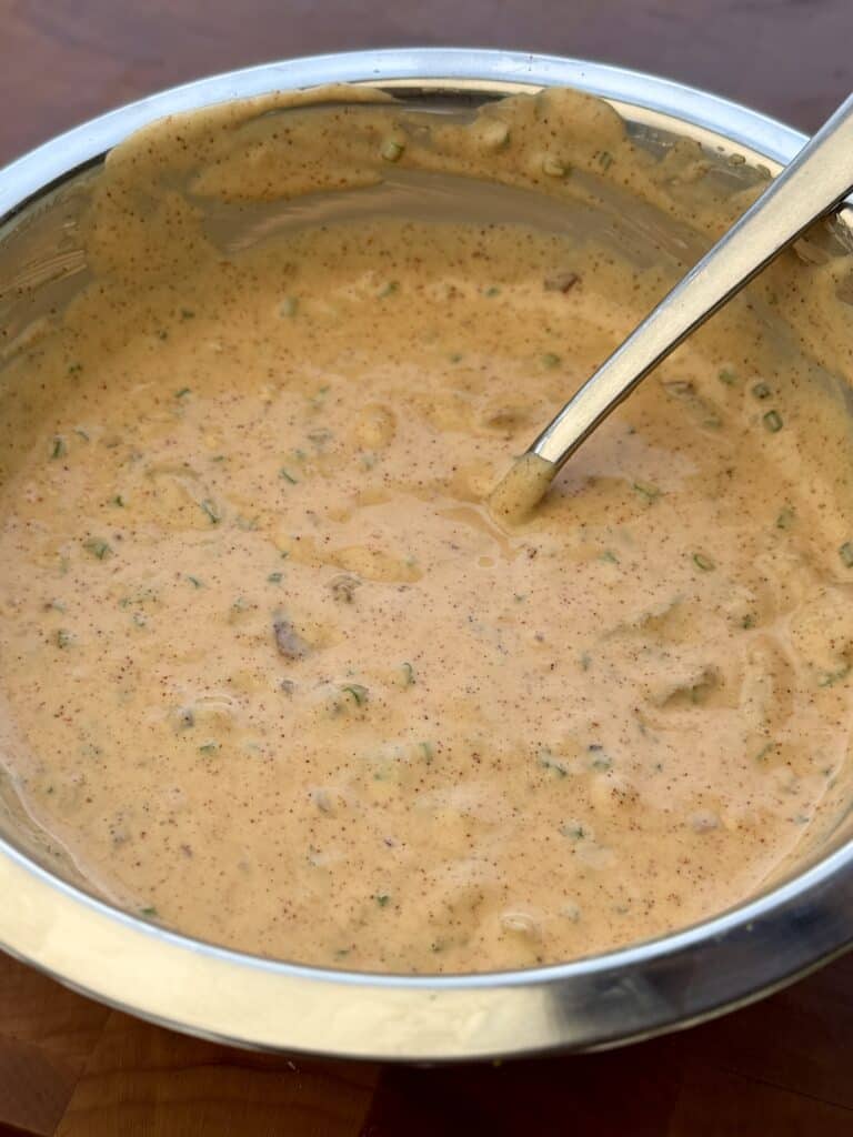 Sauce in bowl with spoon.
