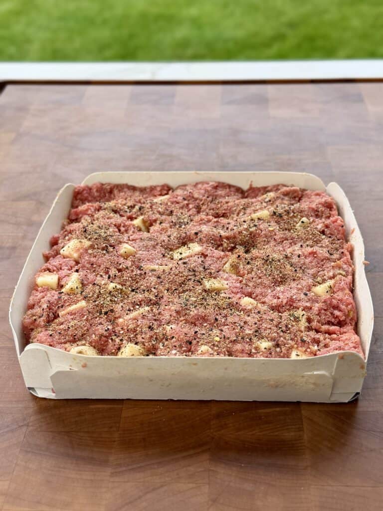 Burger mixture in bun box.