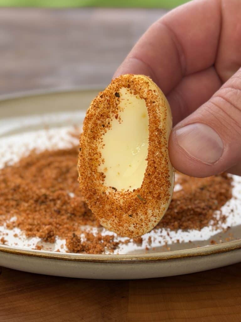 BBQ Deviled Eggs seasoning on egg.