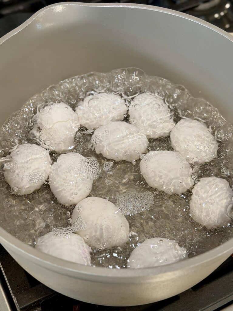 Boiling Eggs in pan.
