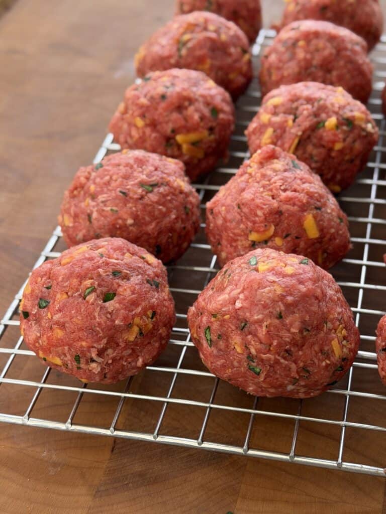 Meatballs on wire rack.
