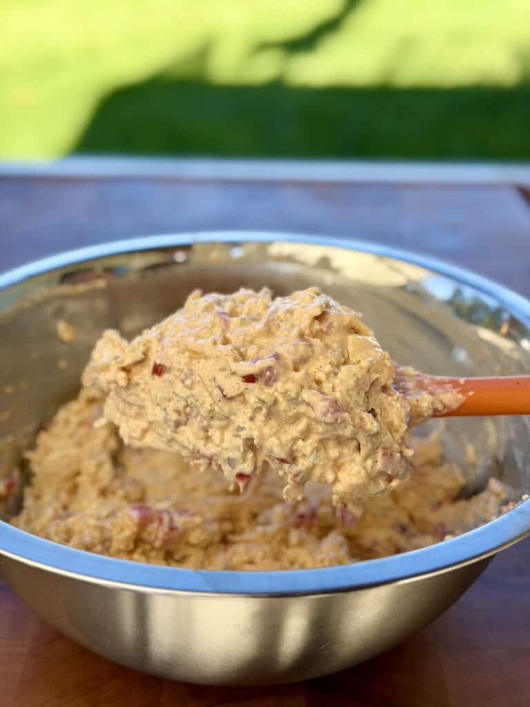 Ingredients in bowl with spatula.