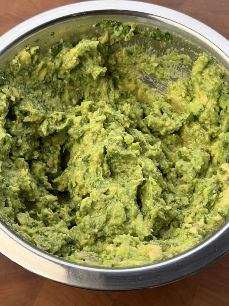 Guac in bowl mixed.