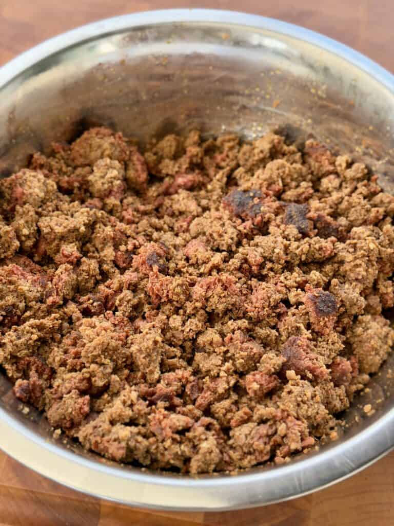 Smoked meat in broken in pieces in Dutch oven.
